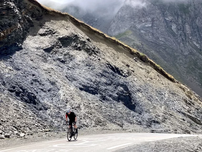 Cyclist climbing the last kilometer of the Tourmalet in the Pyrenees during a bike tour with Veymont Travel