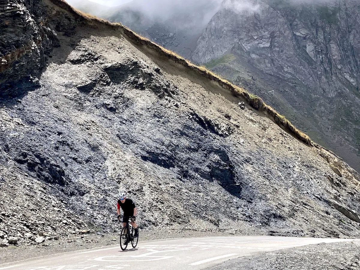 Cyclist climbing the last kilometer of the Tourmalet in the Pyrenees during a bike tour with Veymont Travel