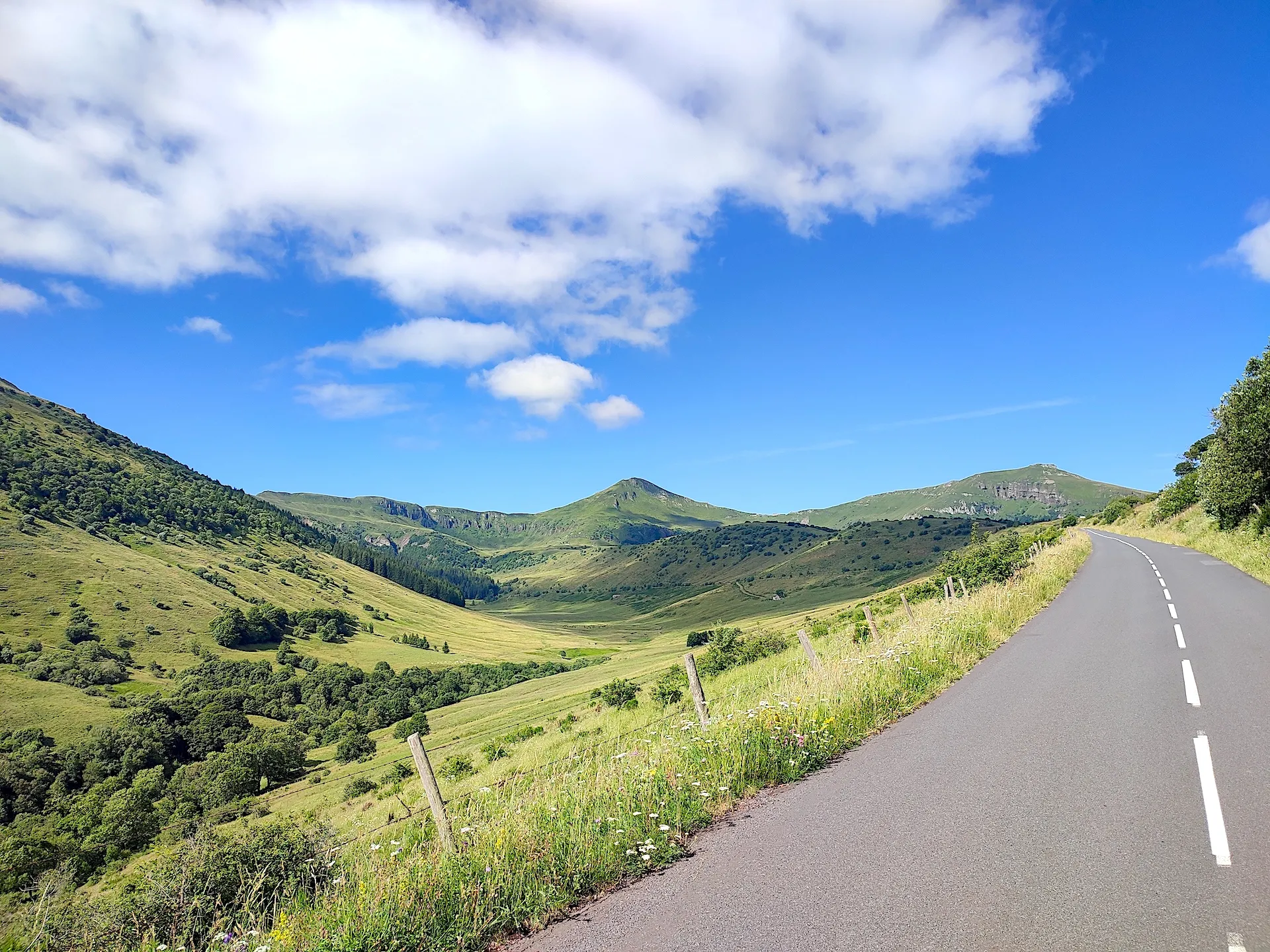 road through the heart of the Auvergne volcanoes and its open, green landscapes