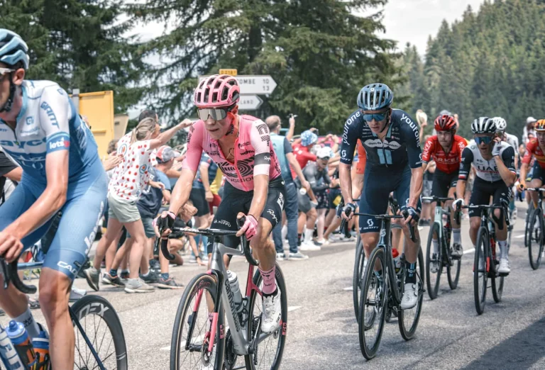 the peloton climbing an Alpine pass during the Tour de France